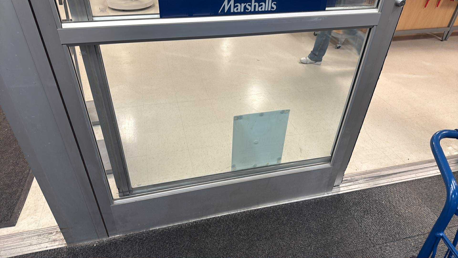 Storefront door with a glass panel section