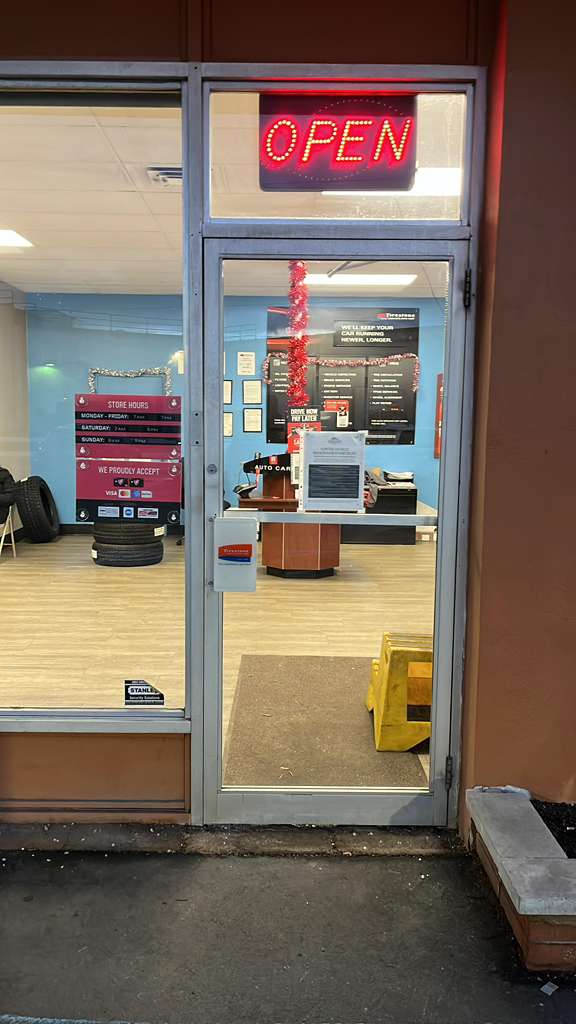 Commercial storefront entry door with open sign