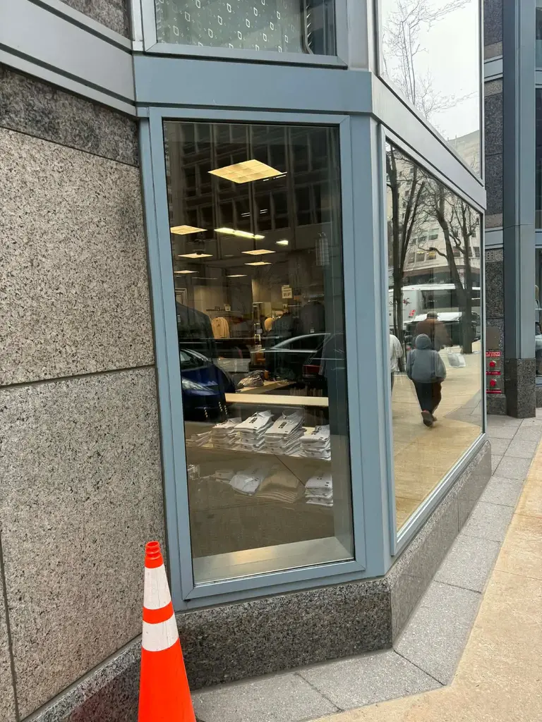Commercial storefront window opening and glass panel